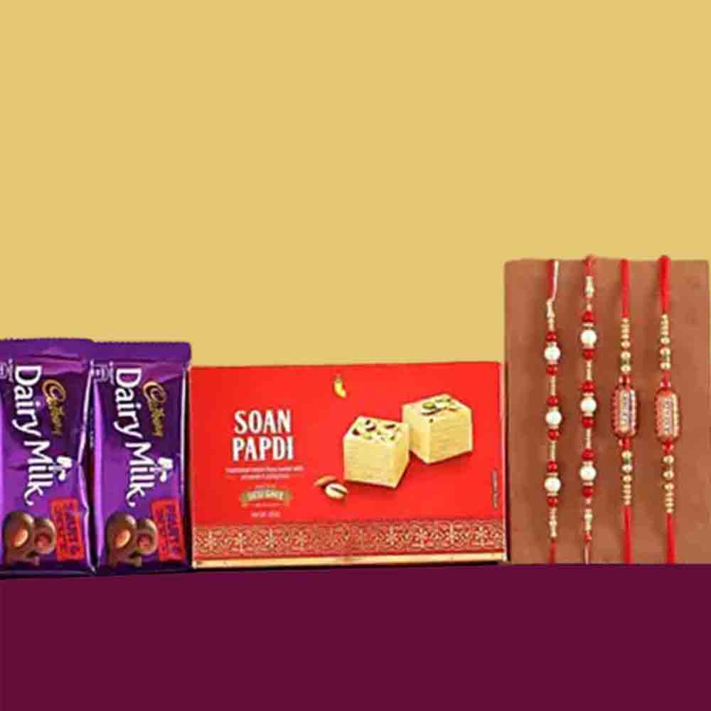 Set Of 4 Rakhis With Dairy Milk and Soan Papdi